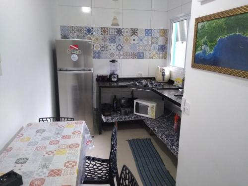 Dapur atau dapur kecil di Guerreiro Sui­tes