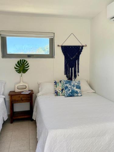 Ένα ή περισσότερα κρεβάτια σε δωμάτιο στο Escape to Villa Aguacate Farm Santa Isabel o Coamo