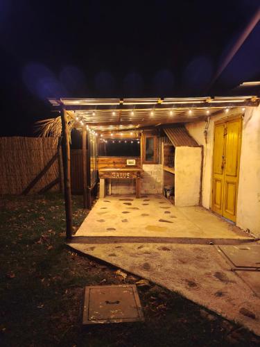 a patio at night with lights on it at Alquilo casa en las Sierras de Minas "VIEJO RANCHO" in Minas