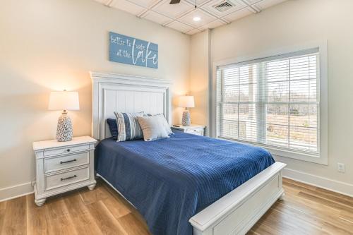 a bedroom with a bed and a window at Lake View and Deck Group Getaway in Grand Rivers! in Grand Rivers