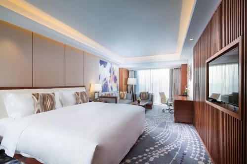 Ένα ή περισσότερα κρεβάτια σε δωμάτιο στο Intercontinental Jinan City Center by IHG