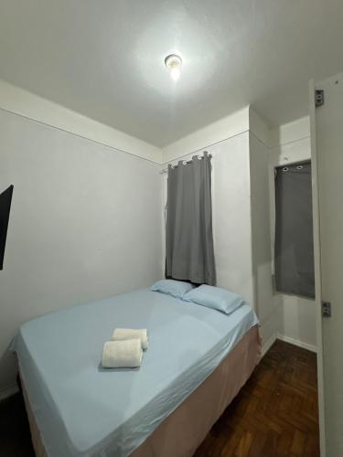 Ένα ή περισσότερα κρεβάτια σε δωμάτιο στο Quarto Em Laranjeiras
