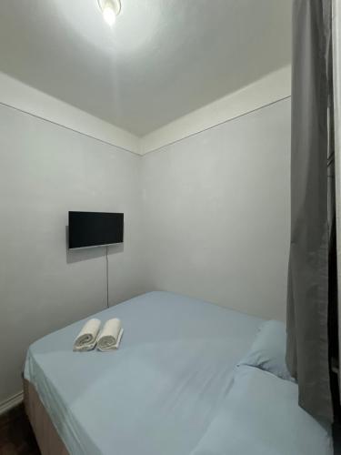Ένα ή περισσότερα κρεβάτια σε δωμάτιο στο Quarto Em Laranjeiras