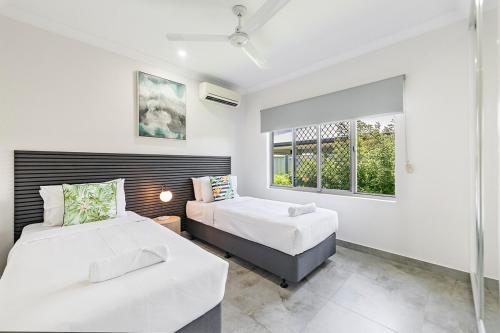 Postel nebo postele na pokoji v ubytování Zenhouse Harmony 4BR Modern Home Near CDU and Hospital