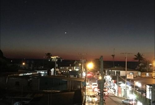a view of a city at night with cars at Casa central in San Juan del Sur