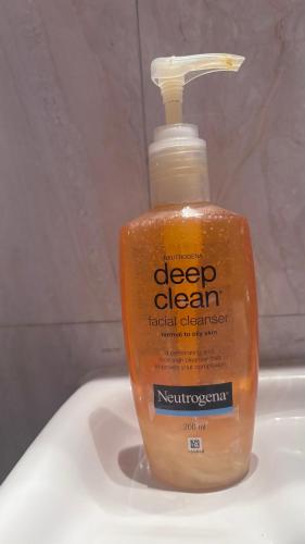 a bottle of detergent sitting on top of a sink at Vrinda stays in Chhatikara