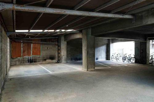 an empty parking garage with bikes parked in it at 岐阜城まで一番近い駅まで徒歩圏内無料駐車場有り in Gifu