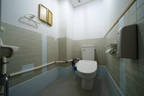 a bathroom with a white toilet in a stall at 岐阜城まで一番近い駅まで徒歩圏内無料駐車場有り in Gifu