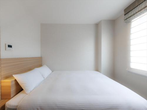 Katil atau katil-katil dalam bilik di JR Kyushu Hotel Kagoshima