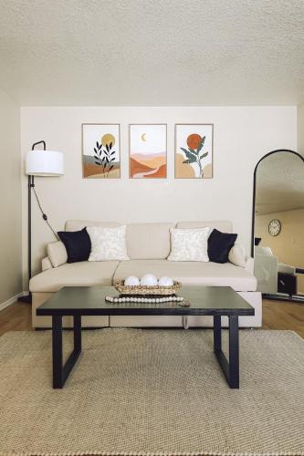 a living room with a couch and a table at Casamor - Richland Home in Richland
