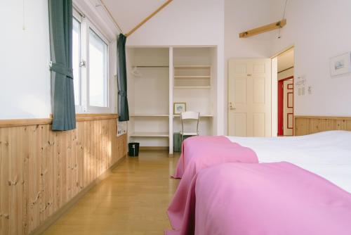 En eller flere senge i et værelse på Lodge Maroray