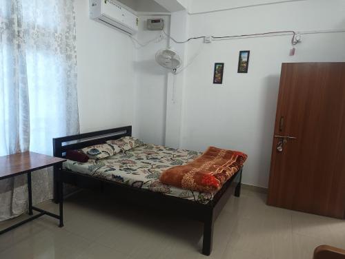 Ένα ή περισσότερα κρεβάτια σε δωμάτιο στο AURA HOMES