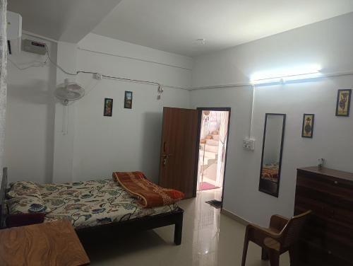 En eller flere senge i et værelse på AURA HOMES