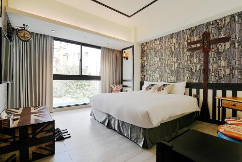 Un ou plusieurs lits dans un hébergement de l'établissement 默臨文旅 台中逢甲館 Morning INN
