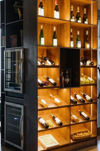 a wine cellar with a bunch of wine bottles at Bishkek Centrum Hotel in Bishkek