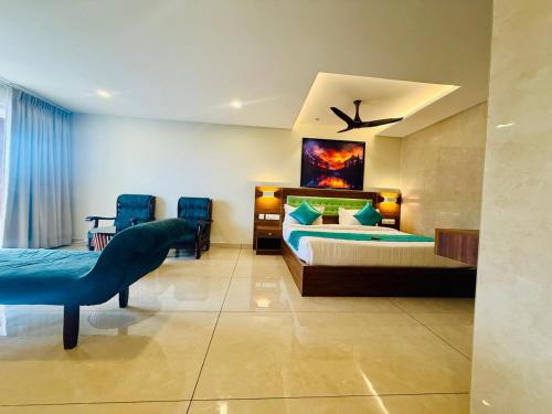 a bedroom with a bed and a bird painting on the wall at Skylark Holidays Premium in Chinnakanal