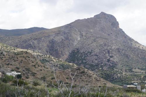 a mountain with a town in front of it at Jason Rooms & Studios in Keratokampos