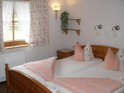 a bedroom with two beds and a window at Seppl's Holiday Home Comfortable holiday residence in Sautens