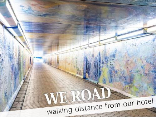 a hallway in a building with the words we road walking distance from our hotel at Hotel Amethyst in Tokyo