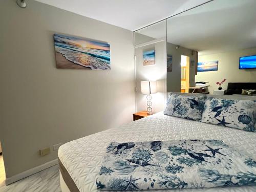 a bedroom with a large bed in a room at Aqua Aloha Surf Waikiki Hotel, 5 minute walk to the beach in Honolulu
