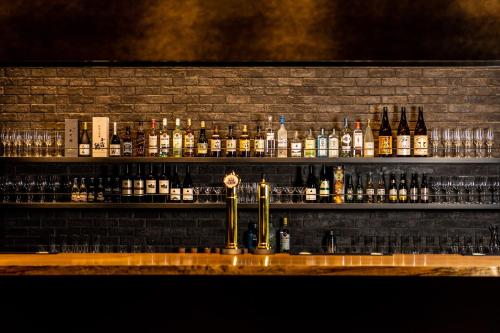 a bar with a lot of bottles of alcohol at Wyndham Garden Sapporo Odori in Sapporo