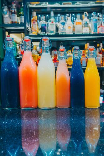a group of bottles of juice on a counter at SureStay Studio by Best Western Clarkview Angeles City in Angeles