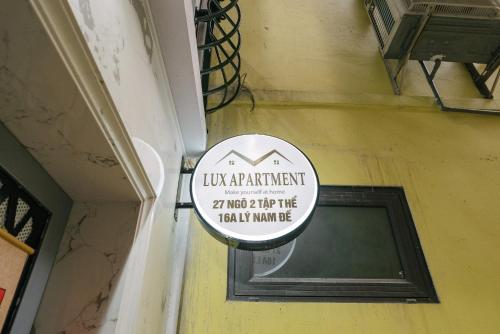 a sign on the side of a building at Train Street Lux Homestay in Hanoi