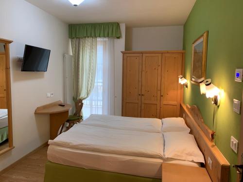 Postel nebo postele na pokoji v ubytování Bed & Breakfast SISSI
