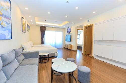 a living room with a couch and a table at Flc Sea Tower Minh Minh in Quy Nhon