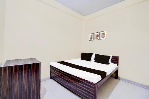 Postel nebo postele na pokoji v ubytování Hotel O Royal Grand Hotel