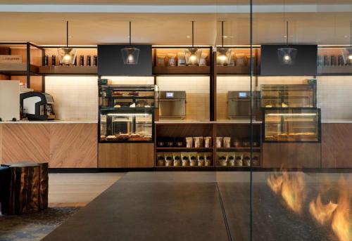 a kitchen with a counter with alcohol bottles at Hotel Alpenrock Breckenridge, Curio Collection by Hilton in Breckenridge
