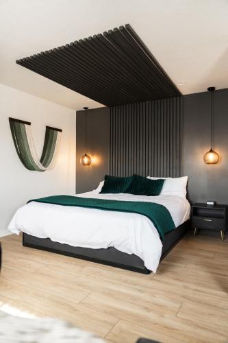 Postel nebo postele na pokoji v ubytování Arcadia Hotel