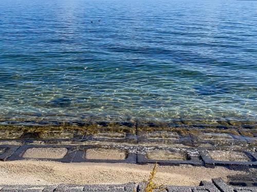 a body of water with some rocks in the water at Pension B,B, Dylan - Vacation STAY 30973v in Otsu