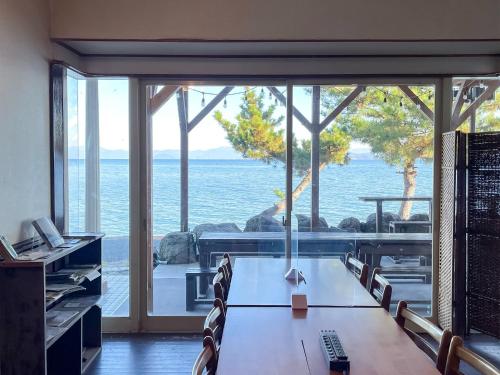 an office with a table and chairs with a view of the ocean at Pension B,B, Dylan - Vacation STAY 30973v in Otsu
