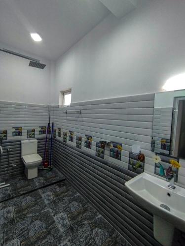 a bathroom with a toilet and a sink at Mirissa Villa Green Pepper in Mirissa