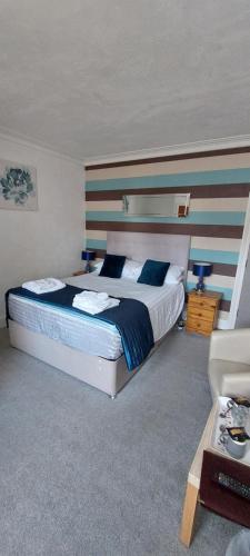 Katil atau katil-katil dalam bilik di Glenavon Guest House
