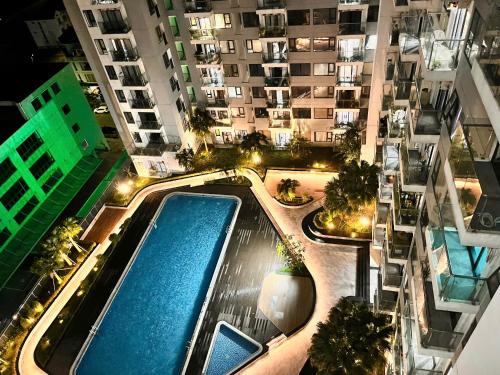 an overhead view of an apartment complex with a swimming pool at Châu Giang Homestay, Nera Garden Huế in Thôn Văn Dương