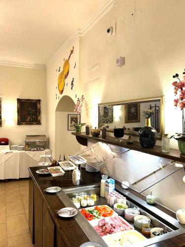a kitchen with a counter with food on it at Hotel Am Schubertring in Vienna