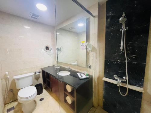 Ένα μπάνιο στο I Lux Hotel Jogja