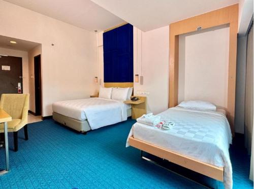 Postel nebo postele na pokoji v ubytování Swiss-Belinn Malang