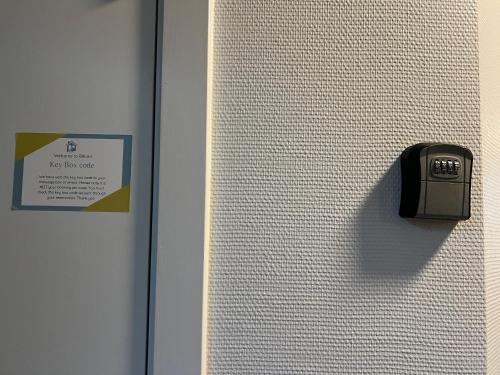 a close up of a door with a sign on it at 5 minute walk to LEGO HOUSE - n18 in Billund
