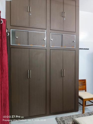 a group of wooden cabinets in a room at Prayag Prasadam in Allahābād
