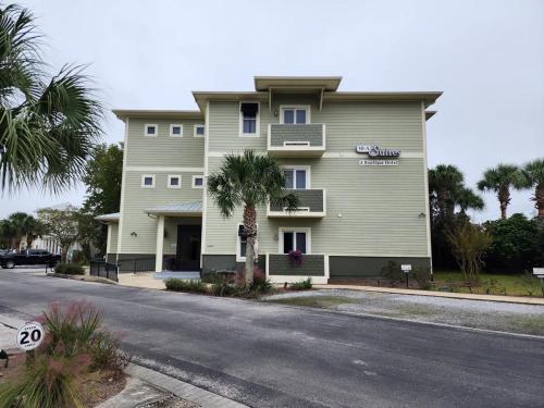 a large building on the side of a street at 30A Luxury Suite with King Bed, Parking, Pool & Balcony in Santa Rosa Beach