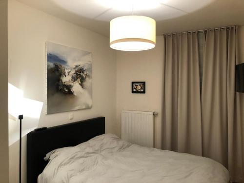 Ένα ή περισσότερα κρεβάτια σε δωμάτιο στο Bel appartement Zeebruges