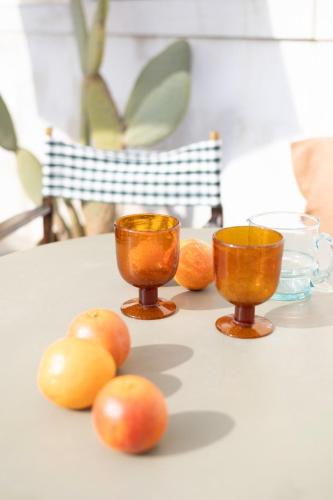 a table with two cups and some fruit on it at Terrazza Momon in Venice