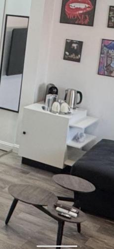 a living room with a bed and a coffee table at Moft Hotel Apartments Free Parking Self Check-In in Oradea