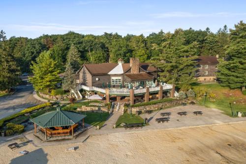 an aerial view of a large house with a yard at Cabin in the Skye - 5 BDs Lake Harmony in Lake Harmony
