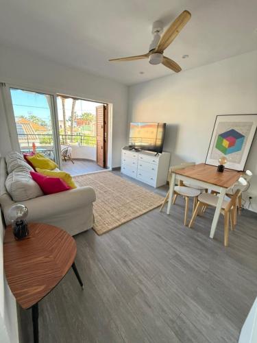 a living room with a couch and a table at Two Bedroom Apartment in Santiago De La Ribera in San Javier