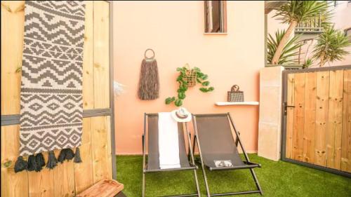 a room with a fence and a table with a mirror at Gateway Suites in Rethymno Town