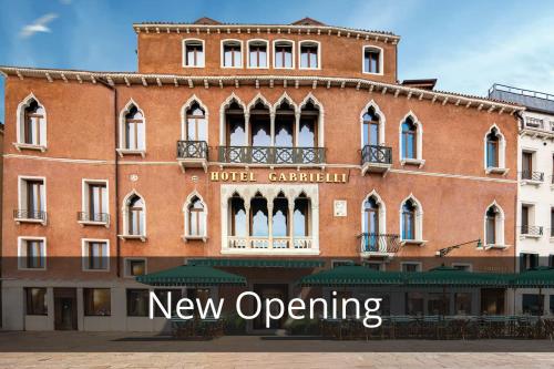 a large brick building with the words new opening at Hotel Gabrielli Venezia - Starhotels Collezione in Venice